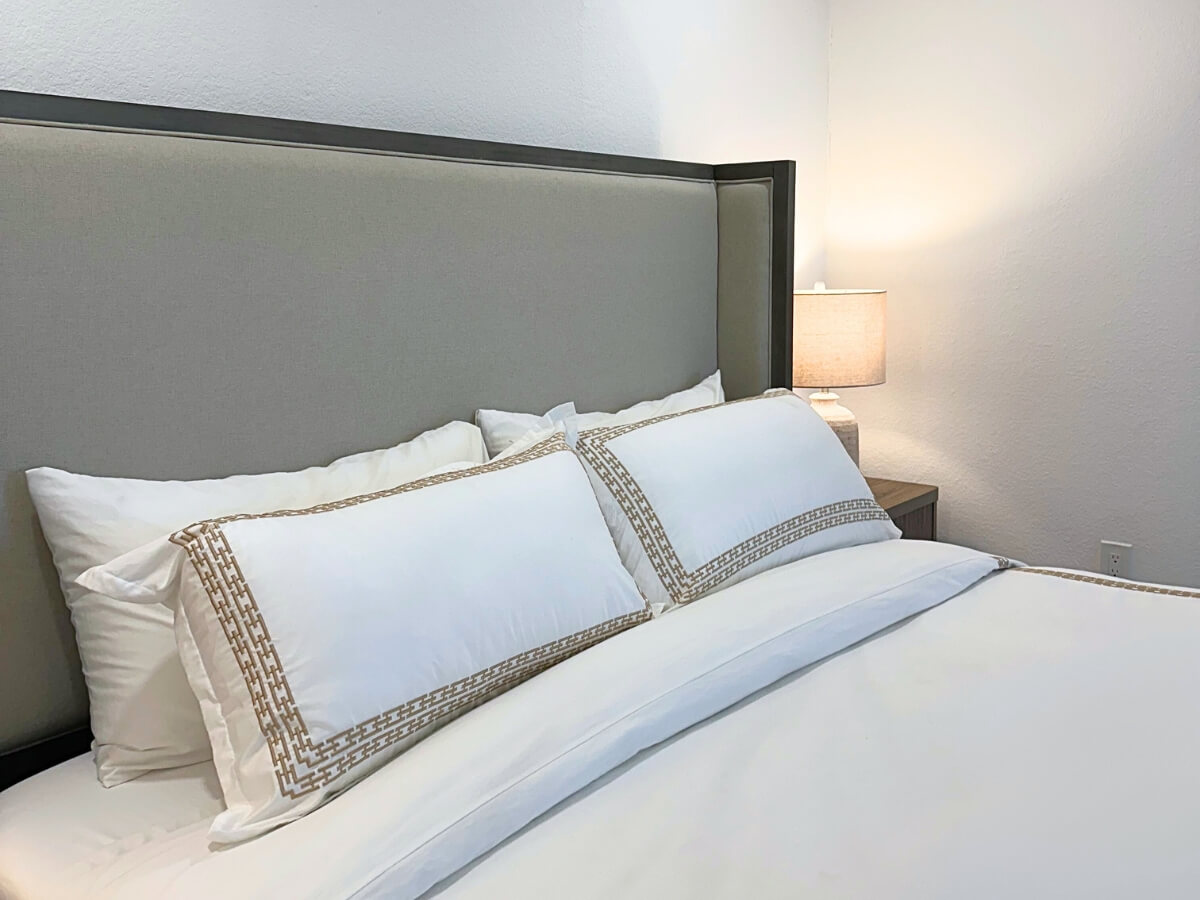 Get Cleaning Services in Pinecrest, FL | Bright Cleanup Management Professionally made bed after Bright Cleanup cleaned this condo in Miami